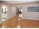 View into the bedroom with hardwood floors, featuring bathroom and walk in closet access at 2815 Cambridge Hills Rd, Cumming, GA 30041