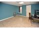 Finished basement bedroom with tile floor, ample light and desk at 2815 Cambridge Hills Rd, Cumming, GA 30041