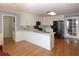 Modern kitchen with white cabinets, stainless steel appliances, and a breakfast bar at 2815 Cambridge Hills Rd, Cumming, GA 30041