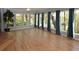 Bright and spacious living room featuring hardwood floors, large windows, and blue curtains at 2815 Cambridge Hills Rd, Cumming, GA 30041
