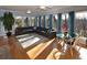 Sunlit living room featuring hardwood floors, a large sectional, and dining area at 2815 Cambridge Hills Rd, Cumming, GA 30041
