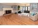 Spacious living room with hardwood floors, fireplace, and a large bay window area at 2815 Cambridge Hills Rd, Cumming, GA 30041
