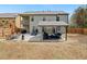 Backyard featuring fenced in lot, covered patio, and chairs at 3541 Stoneleigh Walk, Lithonia, GA 30038