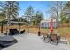 Backyard featuring a covered patio with outdoor seating, shed, and well-maintained lawn area at 3541 Stoneleigh Walk, Lithonia, GA 30038