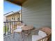 Outdoor balcony featuring a cozy seating area and neighborhood views at 3541 Stoneleigh Walk, Lithonia, GA 30038