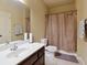 Bathroom featuring a shower with curtain and sink with white countertop at 3541 Stoneleigh Walk, Lithonia, GA 30038