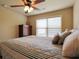 Cozy bedroom with ceiling fan and natural light at 3541 Stoneleigh Walk, Lithonia, GA 30038