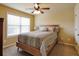Bedroom featuring ceiling fan, light, and natural lighting at 3541 Stoneleigh Walk, Lithonia, GA 30038