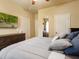 Bedroom with attached full bath and ample lighting at 3541 Stoneleigh Walk, Lithonia, GA 30038