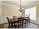 Traditional dining room with chandelier and dining table with seating for six at 3541 Stoneleigh Walk, Lithonia, GA 30038