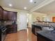 Stylish kitchen with stainless steel appliances and dark wood cabinetry at 3541 Stoneleigh Walk, Lithonia, GA 30038