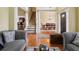 Cozy living room with hardwood floors, grey couches, and staircase at 3541 Stoneleigh Walk, Lithonia, GA 30038