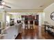 Open-concept living space with modern kitchen, dining area, and comfortable seating at 3541 Stoneleigh Walk, Lithonia, GA 30038