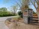 Stone sign reading Crestview Manor nestled amidst lush greenery at 3541 Stoneleigh Walk, Lithonia, GA 30038