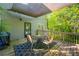 Outdoor back deck features outdoor seating, a grill, and scenic view of a wooded backyard at 3988 Centennial Trl, Duluth, GA 30096