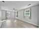 Large bedroom with hardwood floors, ceiling fan, and natural light at 3988 Centennial Trl, Duluth, GA 30096