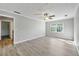 Spacious bedroom with hardwood floors, ceiling fan and ample natural light at 3988 Centennial Trl, Duluth, GA 30096