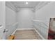Walk-in closet with hardwood floors and wire shelving at 3988 Centennial Trl, Duluth, GA 30096