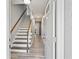 Bright entryway featuring hardwood floors and staircase leading to the upper level at 3988 Centennial Trl, Duluth, GA 30096