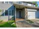 Welcoming front porch with stone accents, leading to the front door and garage at 3988 Centennial Trl, Duluth, GA 30096