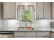 Modern kitchen features granite counters, stainless steel appliances, and natural light at 3988 Centennial Trl, Duluth, GA 30096