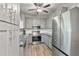 Well-equipped kitchen with stainless steel appliances and gray cabinets at 3988 Centennial Trl, Duluth, GA 30096