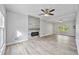 Spacious living room with a modern fireplace and abundant natural light at 3988 Centennial Trl, Duluth, GA 30096