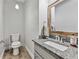 Stylish powder room features granite counters and modern fixtures at 3988 Centennial Trl, Duluth, GA 30096