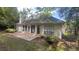 Back exterior featuring a patio, large windows, and sliding glass doors for natural light at 209 Southerness Ct, Stockbridge, GA 30281