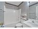 Bathroom features a combination shower and bathtub at 209 Southerness Ct, Stockbridge, GA 30281