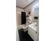 Charming bathroom with black and white checkered floor, tub and shower combination at 209 Southerness Ct, Stockbridge, GA 30281