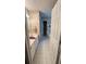 Bathroom with a vanity, mirror, and hallway leading to the toilet at 209 Southerness Ct, Stockbridge, GA 30281