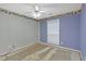 Bedroom featuring a ceiling fan and window at 209 Southerness Ct, Stockbridge, GA 30281