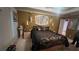 Opulent bedroom with decorative wall art, lamps, and a luxurious bed at 209 Southerness Ct, Stockbridge, GA 30281