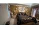 Primary bedroom with elegant bedding, bedside decor, and a serene ambiance for restful nights at 209 Southerness Ct, Stockbridge, GA 30281