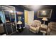 Inviting bedroom with ample lighting, mirrors, and comfortable seating creating a serene space at 209 Southerness Ct, Stockbridge, GA 30281