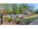 A tranquil community pool and lounging area surrounded by lush greenery and a secure fence at 209 Southerness Ct, Stockbridge, GA 30281
