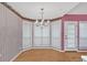 Bright breakfast nook with a bay window and light fixture above at 209 Southerness Ct, Stockbridge, GA 30281