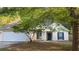 Charming one-story home featuring a classic design, attached garage, and neatly maintained front yard at 209 Southerness Ct, Stockbridge, GA 30281