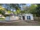 A charming one-story home with a stucco exterior, attached garage, and well-maintained landscaping at 209 Southerness Ct, Stockbridge, GA 30281