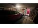 Spacious garage with vehicle, storage racks, and wall-mounted clothing rack at 209 Southerness Ct, Stockbridge, GA 30281
