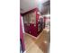 Hallway with hardwood floors, art, a ceiling fan, and mirrors at 209 Southerness Ct, Stockbridge, GA 30281