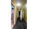 Hallway with light fixtures and mirror creating an open and airy atmosphere for seamless navigation at 209 Southerness Ct, Stockbridge, GA 30281