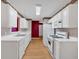 Functional kitchen with white appliances and countertops, great for cooking at 209 Southerness Ct, Stockbridge, GA 30281