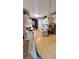 Features kitchen with wooden floors, white appliances, and an adjacent dining area at 209 Southerness Ct, Stockbridge, GA 30281