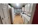 This kitchen features white cabinets, appliances, and a breakfast nook with bay windows at 209 Southerness Ct, Stockbridge, GA 30281