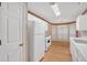 Efficient kitchen featuring white appliances and a cozy dining area at 209 Southerness Ct, Stockbridge, GA 30281