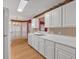 Well-equipped kitchen with white cabinets and an adjacent dining area at 209 Southerness Ct, Stockbridge, GA 30281