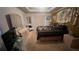 The main bedroom is spacious with tan walls and a tray ceiling at 209 Southerness Ct, Stockbridge, GA 30281
