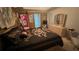 The main bedroom is spacious with tan walls and a tray ceiling at 209 Southerness Ct, Stockbridge, GA 30281